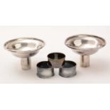 Two silver funnels; and three silver napkin rings,