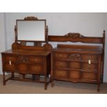 A carved oak part bedroom suite.