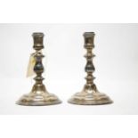 A pair of silver candlesticks.