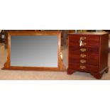 An Edwardian overmantel mirror; and a John Austin Ltd music cabinet.