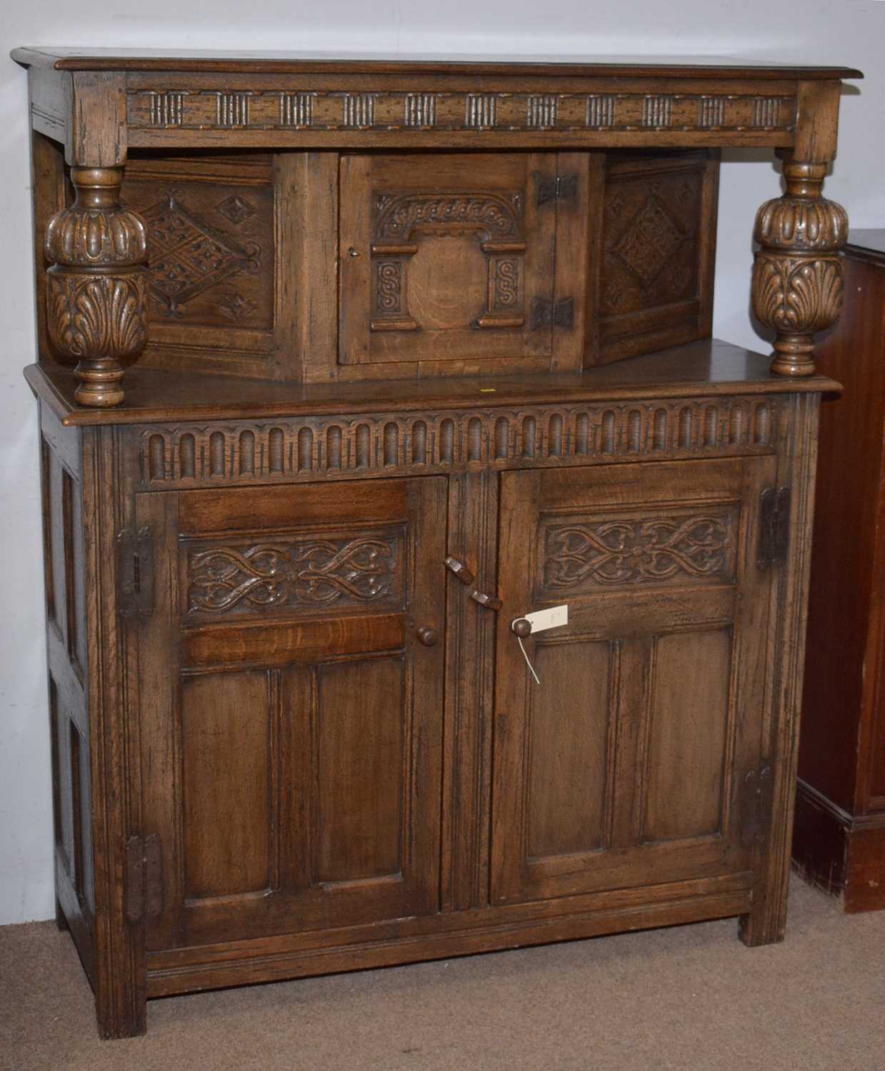 A 17th Century style carved oak buffet.