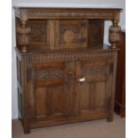 A 17th Century style carved oak buffet.