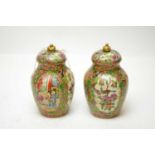 Pair of 19th Century Cantonese famille rose vases and covers.