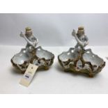 A pair of German ceramic spill vases or comports.