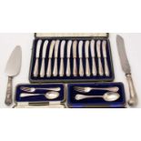 Cased tea knives, two sets of silver spoon and fork, and other items.