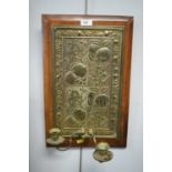 An early 20th C embossed and mounted brass wall plaque.