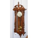 A walnut Vienna-style wall clock.