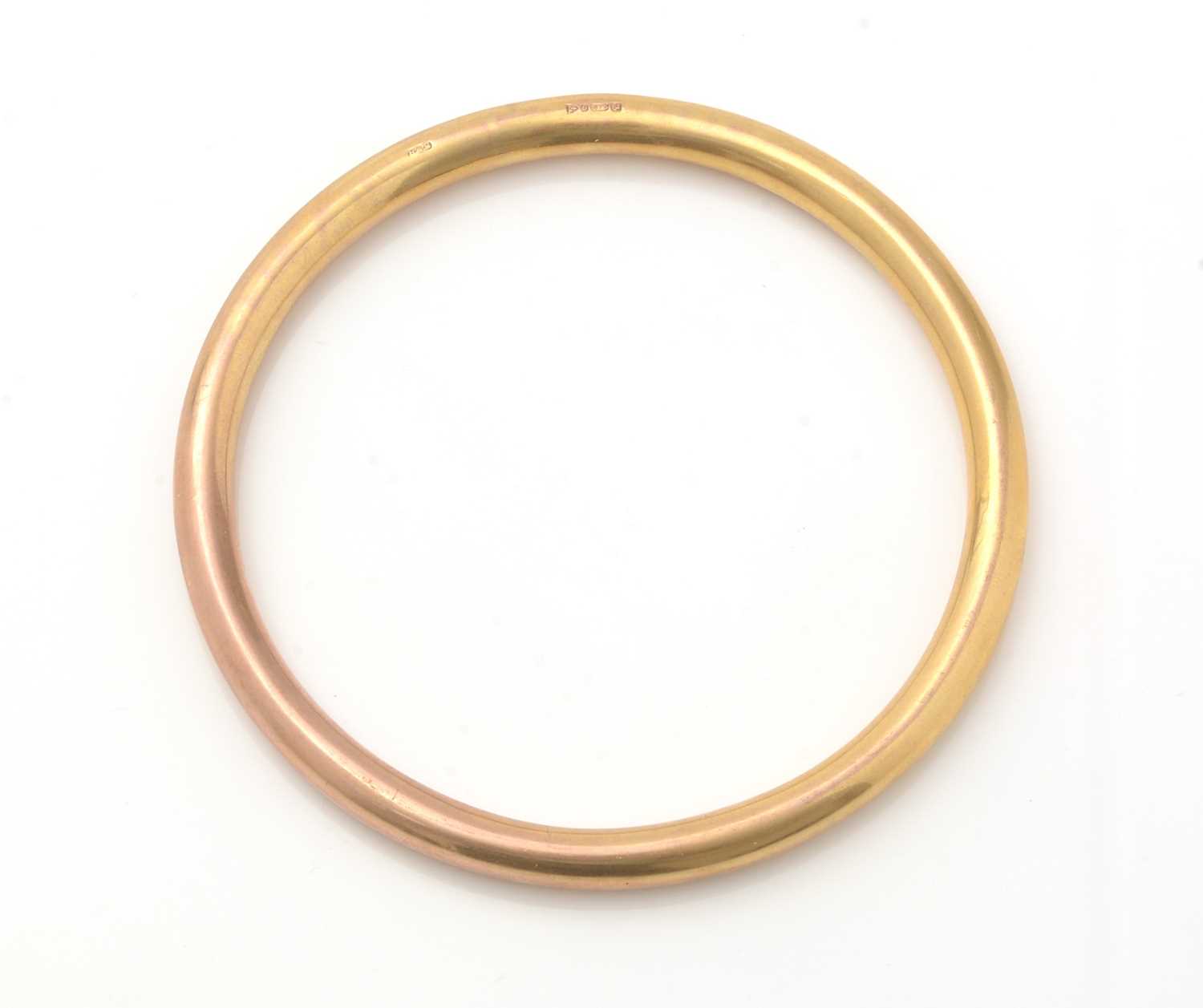 A 9ct yellow gold bangle,