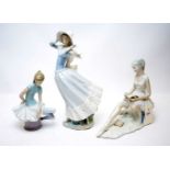 Two Lladro figures; and a Tengra figure.