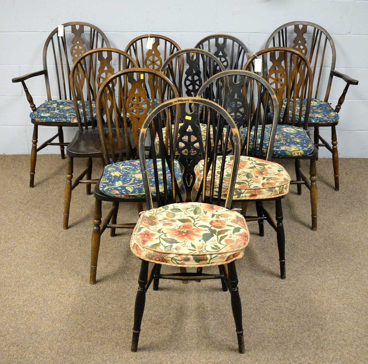 Ten assorted 20th Century rustic wheelback dining chairs
