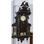 A Vienna style ebonised wall clock.