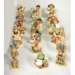 A selection of Hummel figures of children.
