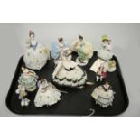 A selection of Dresden and other Continental ceramic crinoline figures.