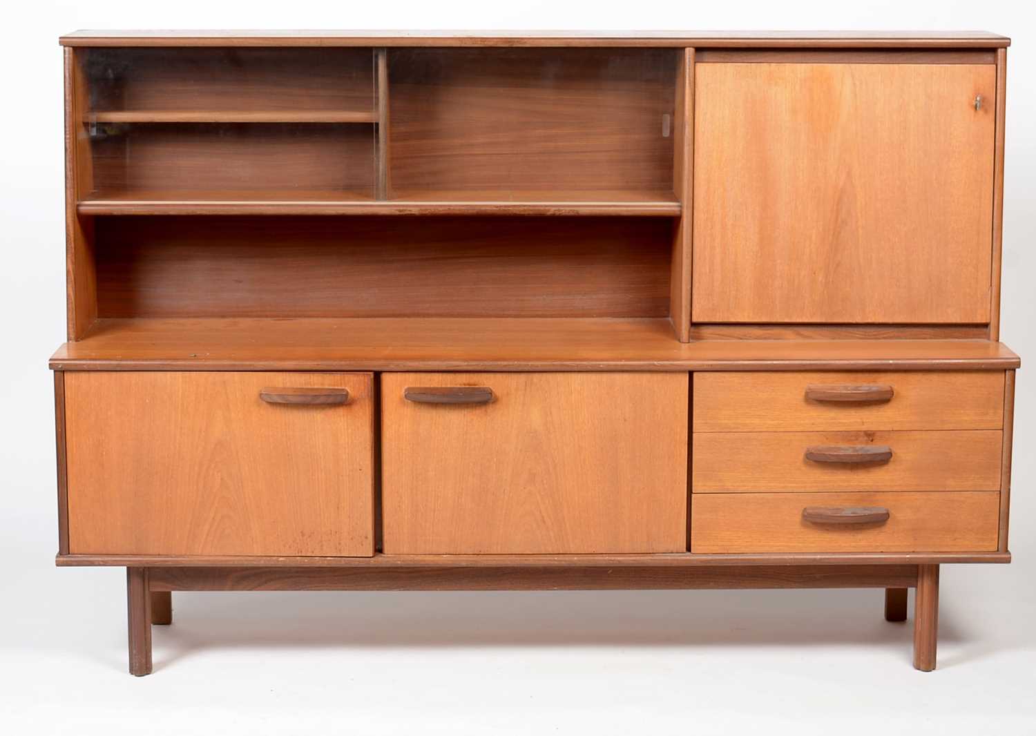 A mid Century teak high board credenza