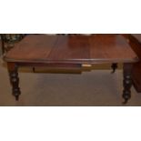 A substantial Victorian mahogany draw leaf dining table.