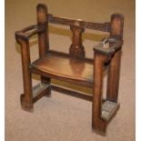 An early 20th Century carved oak hall seat/stick stand.