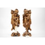 A pair of Japanese carved rootwood figures.
