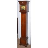 A Georgian-style mahogany grandmother clock.