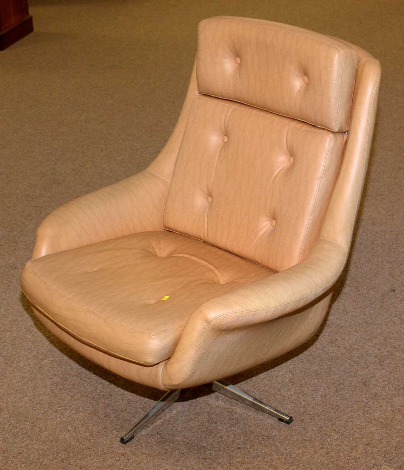 A Mid 20th C design moulded foam swivel armchair.