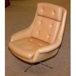 A Mid 20th C design moulded foam swivel armchair.