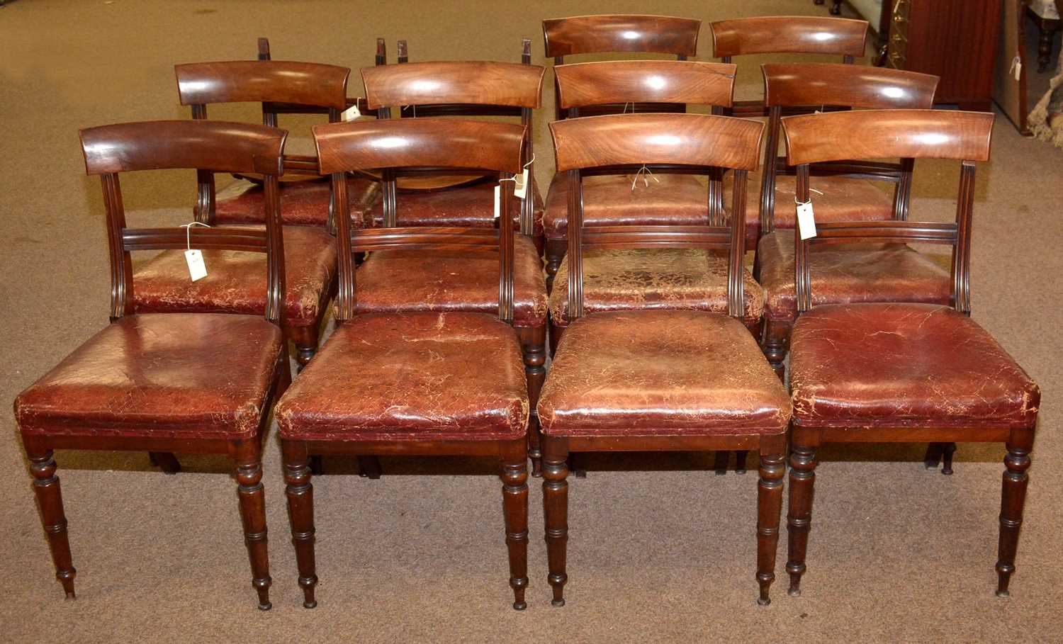 A set of twelve Victorian mahogany dining chairs.