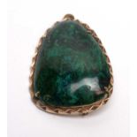 A green-stone and gold brooch,