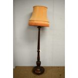 A substantial carved beech standard lamp