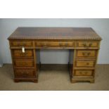 A late Victorian carved mahogany desk