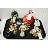A selection of decorative figures, including: Royal Doulton figures