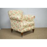 An early 20th century armchair with woven floral upholstery