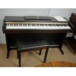 A Yamaha Clavinova CLP-115 Piano and stool.