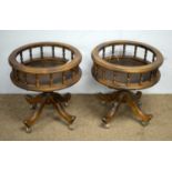 A pair of Victorian style circular beechwood galleried tables