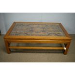 A large Chinese carved and pierced elm coffee table