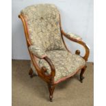 A Victorian rosewood button-back armchair,