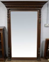 An substantial early 20th century carved oak overmantel mirror.