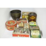 A selection of vintage biscuit and other tins; and other items.