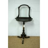 A Victorian gilt and ebonised occasional table/firescreen.