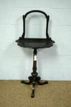 A Victorian gilt and ebonised occasional table/firescreen.