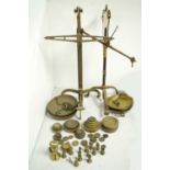 Two sets of brass postal scales and weights.