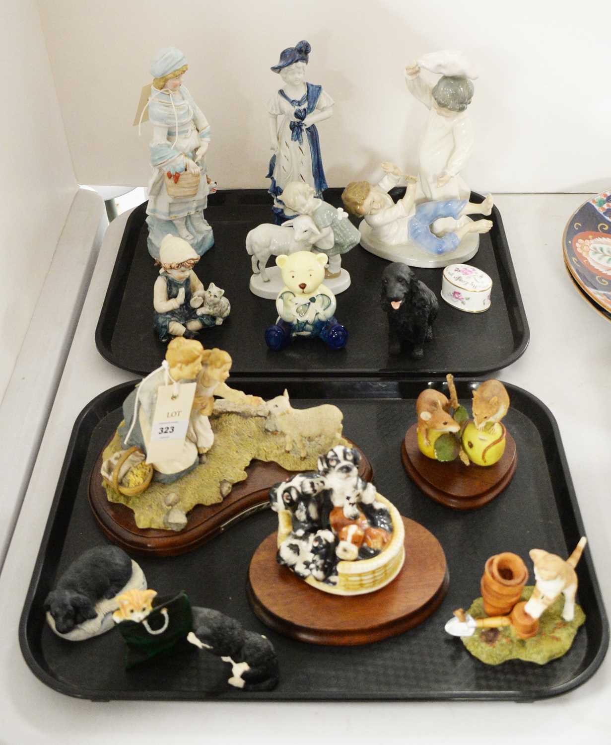 A selection of ceramic and resin decorative figures.