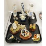 A selection of ceramic and resin decorative figures.