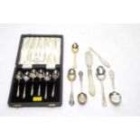 A set of cased silver coffee spoons and other items