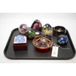 A selection of art glass paperweights.