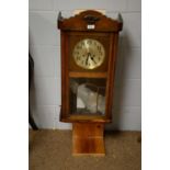 A German wall clock, by H.A.C. Wurggemberg and an American wall clock, by Jerome & Co.