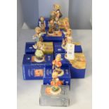 A collection of seven boxed Goebel Hummel Club Exclusive Edition figures of children.
