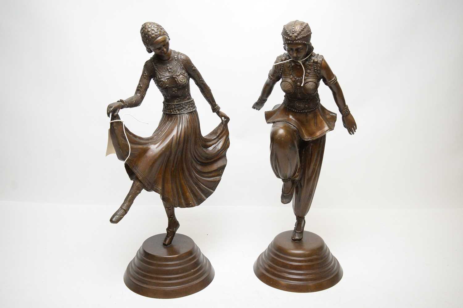 A pair of Art Deco style bronzed figures of dancers.