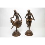 A pair of Art Deco style bronzed figures of dancers.