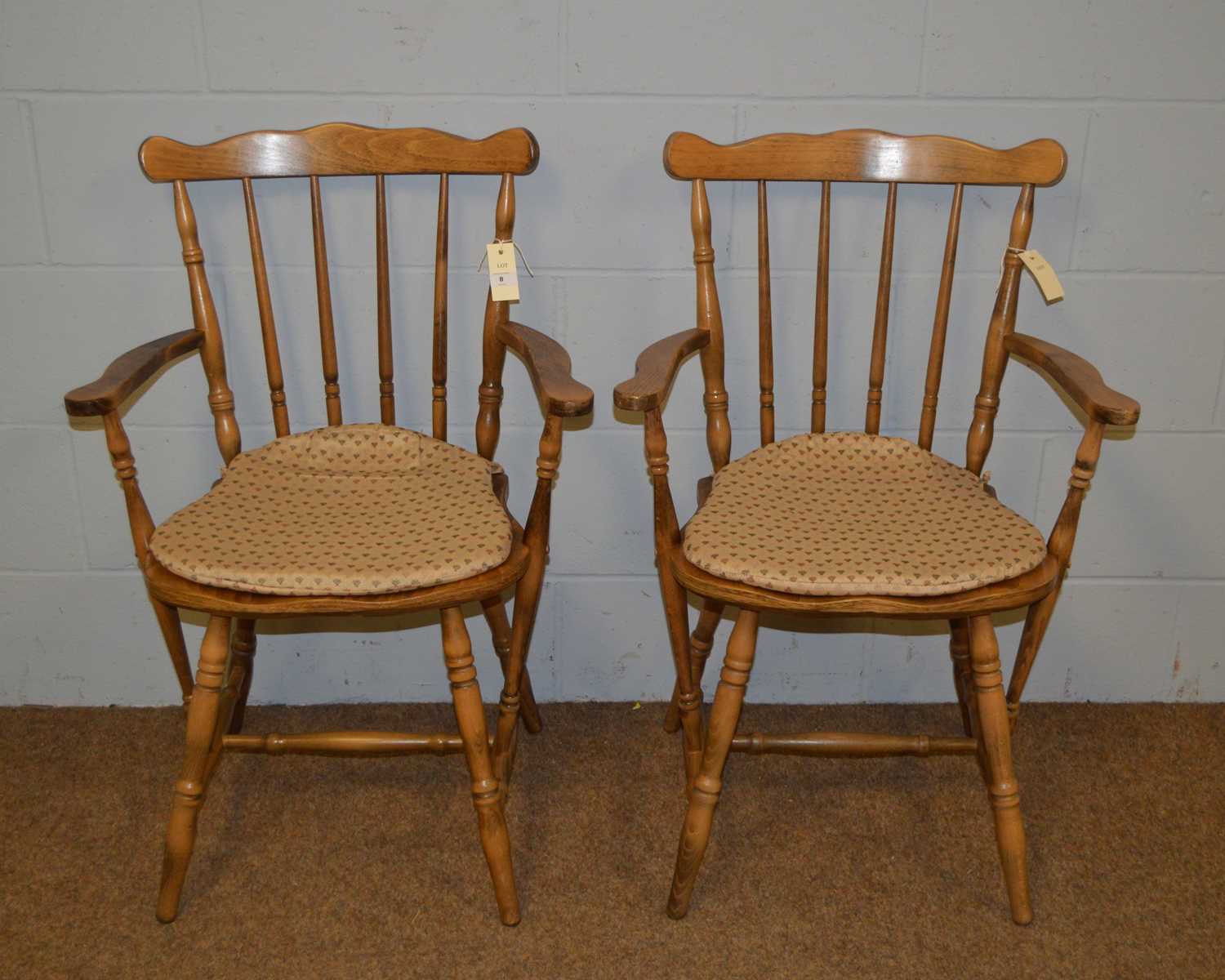 A pair of farmhouse kitchen carver chairs.