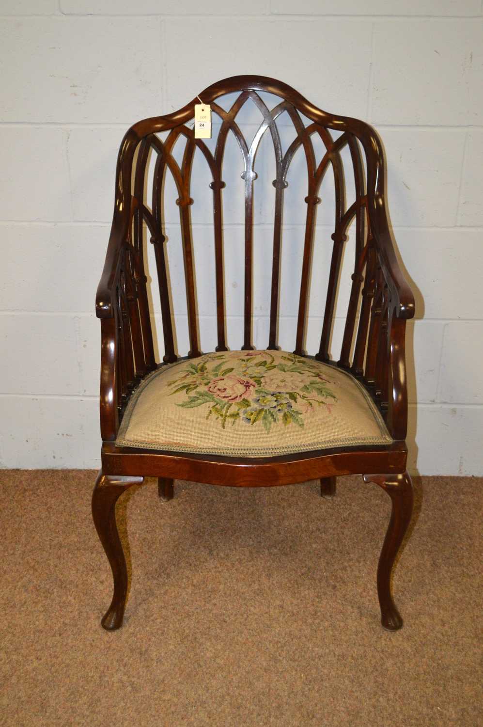 An Edwardian mahogany armchair.