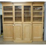 A substantial pine breakfront bookcase/ display case
